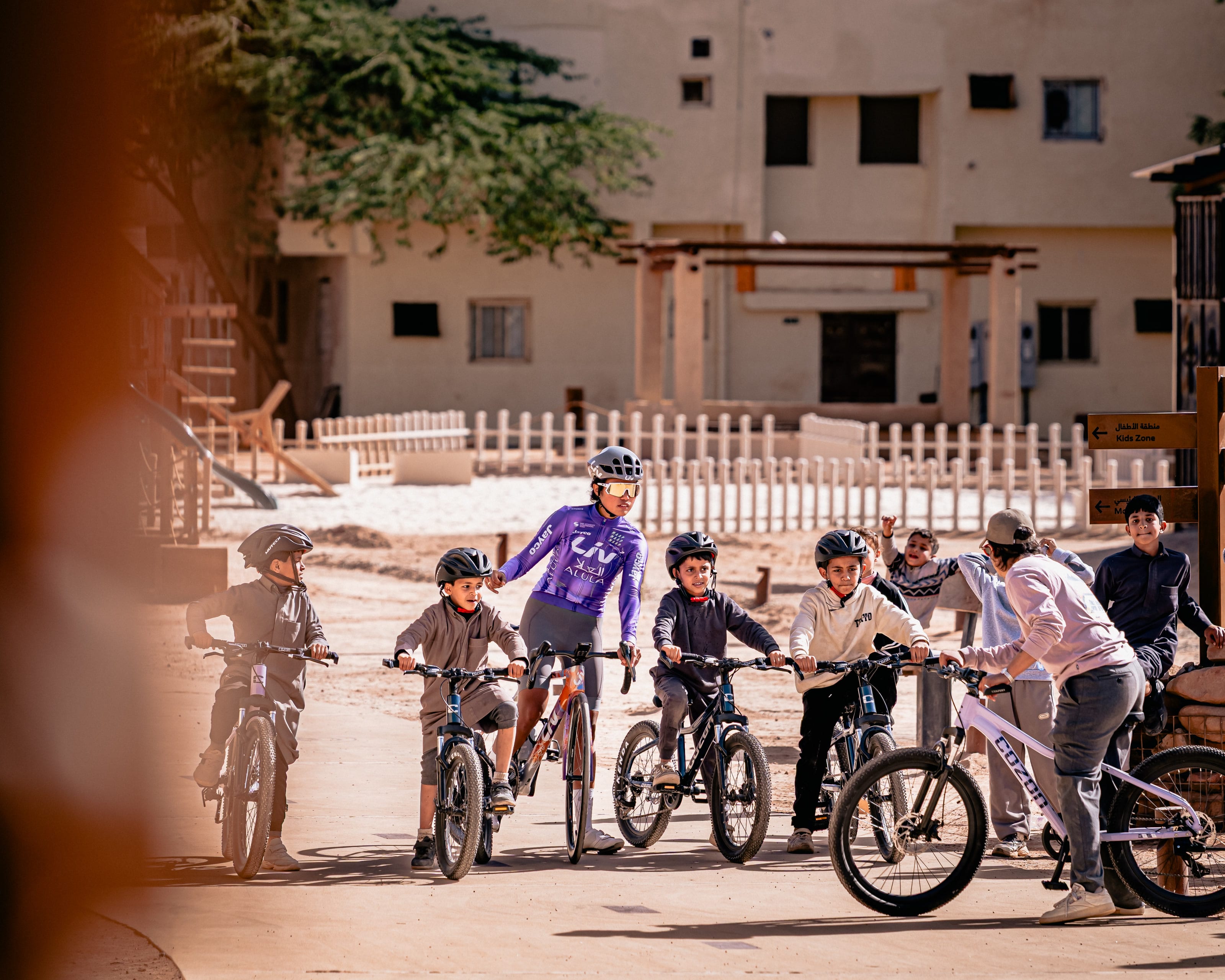 Young riders lined up with Moroj Adil at a training session in AlUla